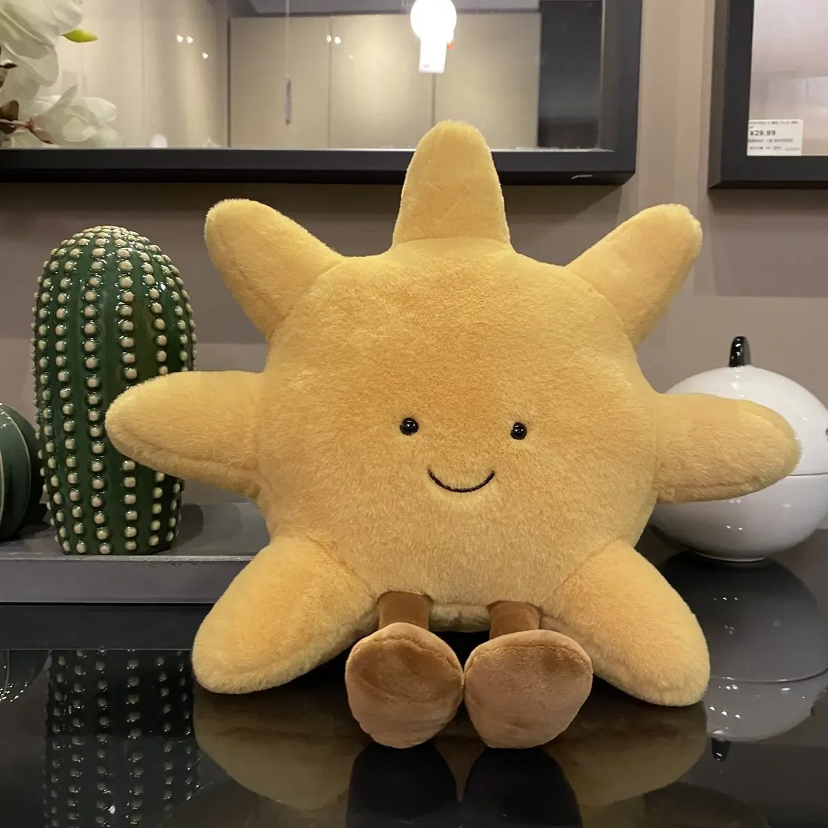 Decorative stuffed animals in the shape of the sun and moon