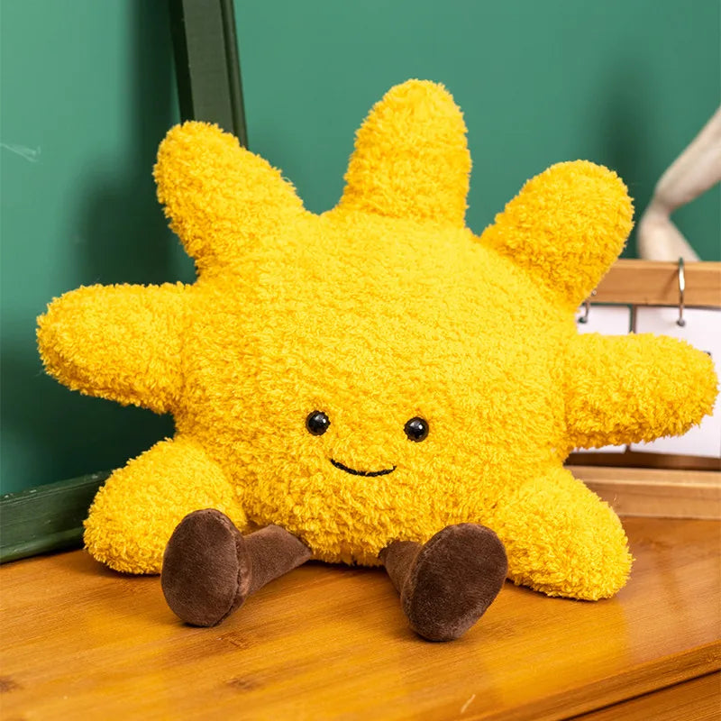 Decorative stuffed animals in the shape of the sun and moon